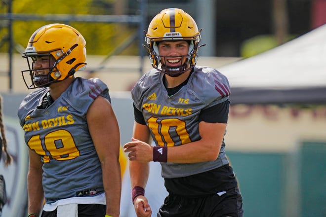 ASU quarterback Sam Leavitt (10) laughs after a completed pass during a spring practice at Kajikawa Practice Fields on April, 24, 2024.