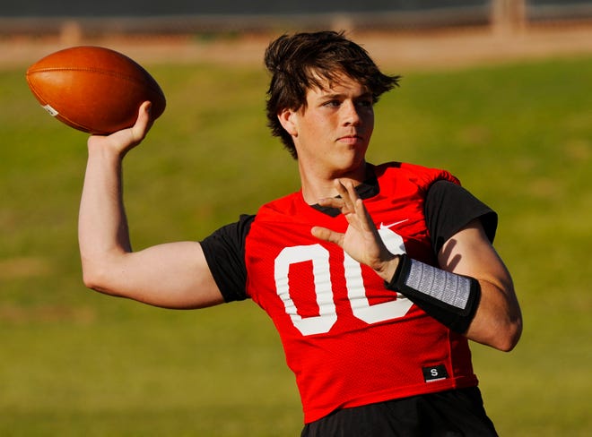 Basha quarterback Brodie Vehrs throws a pass during a practice at Basha High School on April 25, 2024.