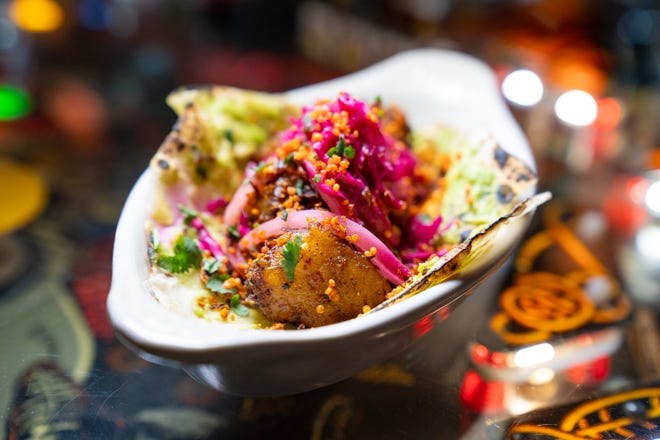 Moodie Blacks, a Tex Mex restaurant, serves up Vegan Death, a taco with fried cauliflower, fried brussel sprouts, salsa macha vin, guac, Japanese peanuts and MB slaw.