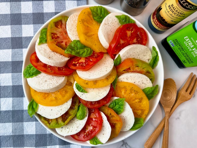 Caprese salad is a simply perfect combination of fresh mozzarella, fresh tomatoes and fresh basil with a good drizzle of oil oil and some salt and pepper.