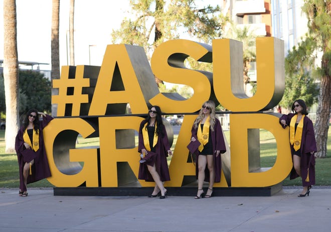 (From left) Hannah Mohan, Erin O'Toole, Annie Katsiris and Marisa Dominguez have their photo taken before Arizona State University's commencement ceremony in Tempe, Ariz., on May 6, 2024.