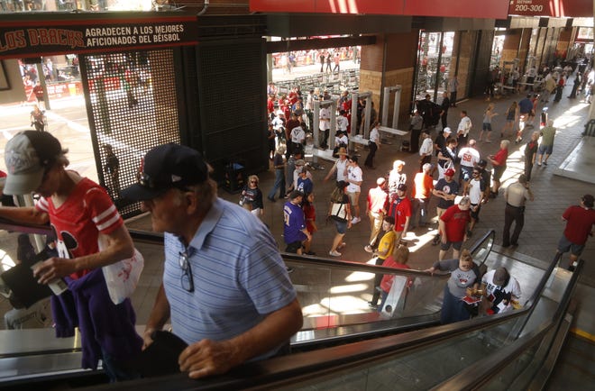 Fans arrive at Chase Field for Arizona Diamondbacks opening day on April 5, 2019.