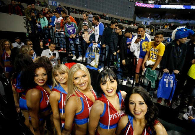Members of the Detroit Pistons cheerleaders pose for photos prior to a regular season game with the Dallas Mavericks in Mexico City, Dec. 12, 2019.