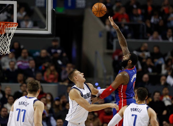 Detroit Pistons' Andre Drummond shoots against Dallas Mavericks in the second half in Mexico City, Dec. 12, 2019.