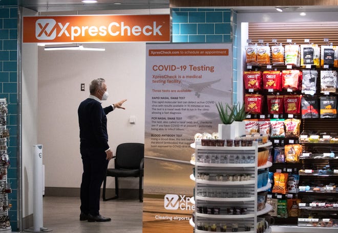 XpresCheck CEO Doug Satzman talks with staff before the opening of XpresCheck's new COVID-19 testing site in Terminal 4 at Sky Harbor International Airport, Phoenix, Arizona on Nov. 23, 2020.