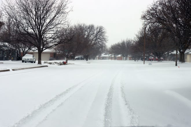 Dreyfuss Road in the Belmar neighborhood is covered with inches of snow during an arctic blast on Valentine's Day.
[Neil Starkey /for the Amarillo Globe-News]