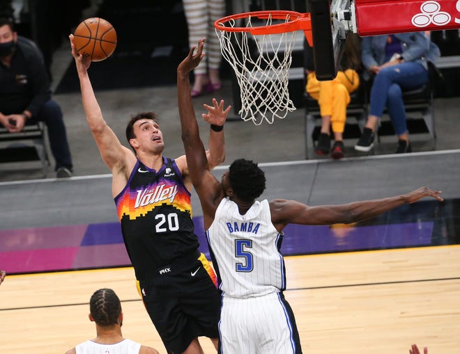 Phoenix Suns forward Dario Saric (20) shoots over Orlando Magic center Mo Bamba (5) during the fourth quarter Feb. 14, 2021.