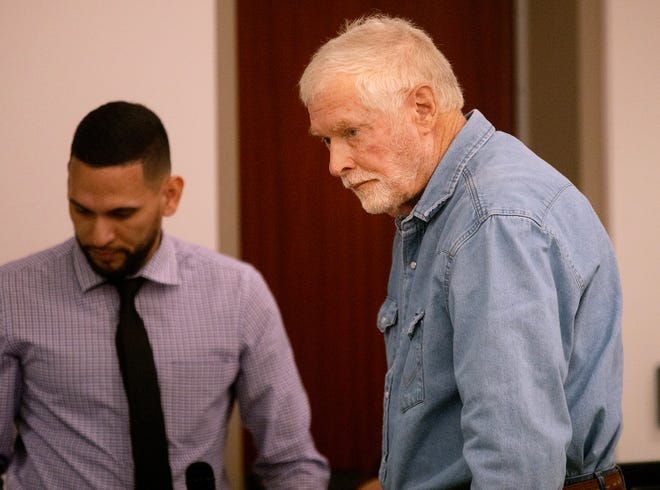 George A. Kelly walks over to his lawyer during his arraignment in Santa Cruz County Superior Court in Nogales, Ariz., on March 6, 2023. Kelly is facing murder and other charges in the shooting of a Mexican national on his border property.