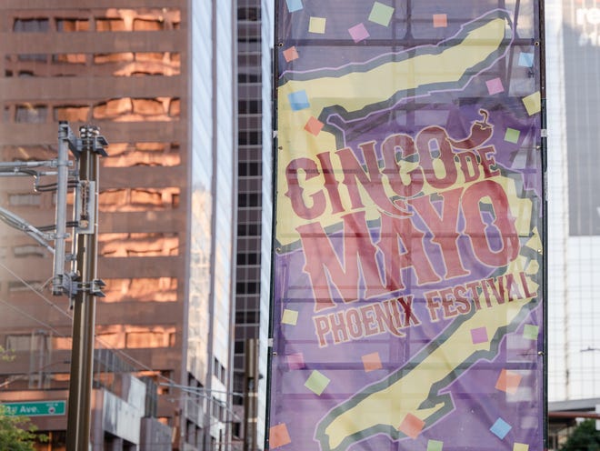 Cinco de Mayo Phoenix Festival signs adorn the festival entrance on May 7, 2023.