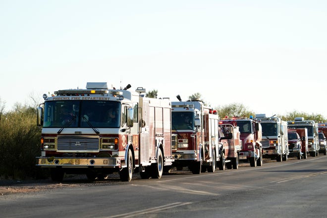 Fire engines stage near the Diamond Fire as it burns south of Rio Verde Drive northeast of Scottsdale on June 27, 2023.
