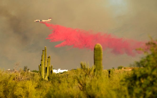 Fire retardant is dropped on the Diamond Fire burns south of Rio Verde Drive in northeast of Scottsdale June 27, 2023.